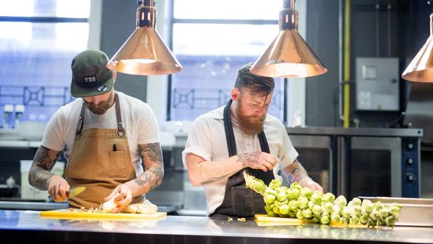 Chefs and co-owners at Ayden restaurant in Saskatoon Dale MacKay and Nathan Guggenheimer (left to right) cut and prepare vegetables. David Stobbe for the Globe and Mail