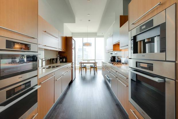 The kitchen boasts Miele appliances and a breakfast nook.