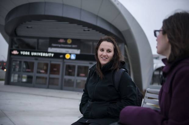 Sarah Greenberg talks to her friend Pippa Dillon-Fordyce in front of the York University subway station in Toronto on Dec. 4, 2017.